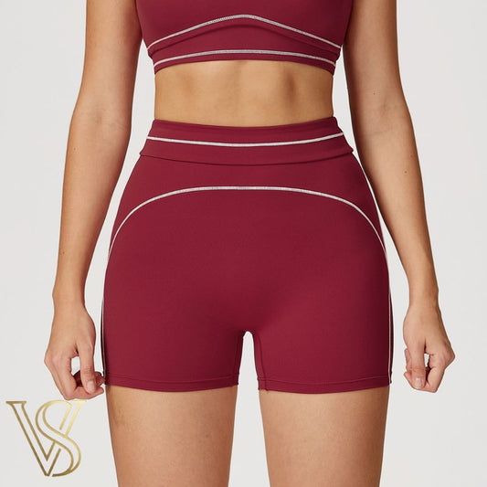 Burgundy high-waisted workout shorts with white piping accents and matching top, part of the vstyles activewear collection.