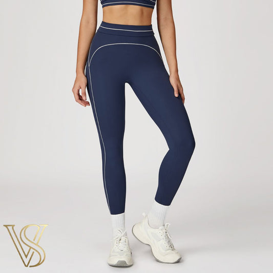 Navy blue high-waisted seamless leggings with white contrast stitching and a double-banded waist, from the vstyles activewear collection.
