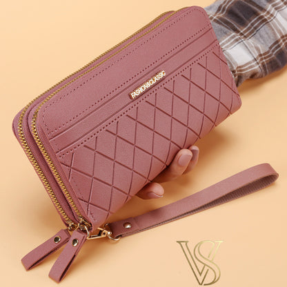 Chic mauve rose long wallet featuring a diamond quilted design, double gold-tone zippers, and a matching wristlet strap.