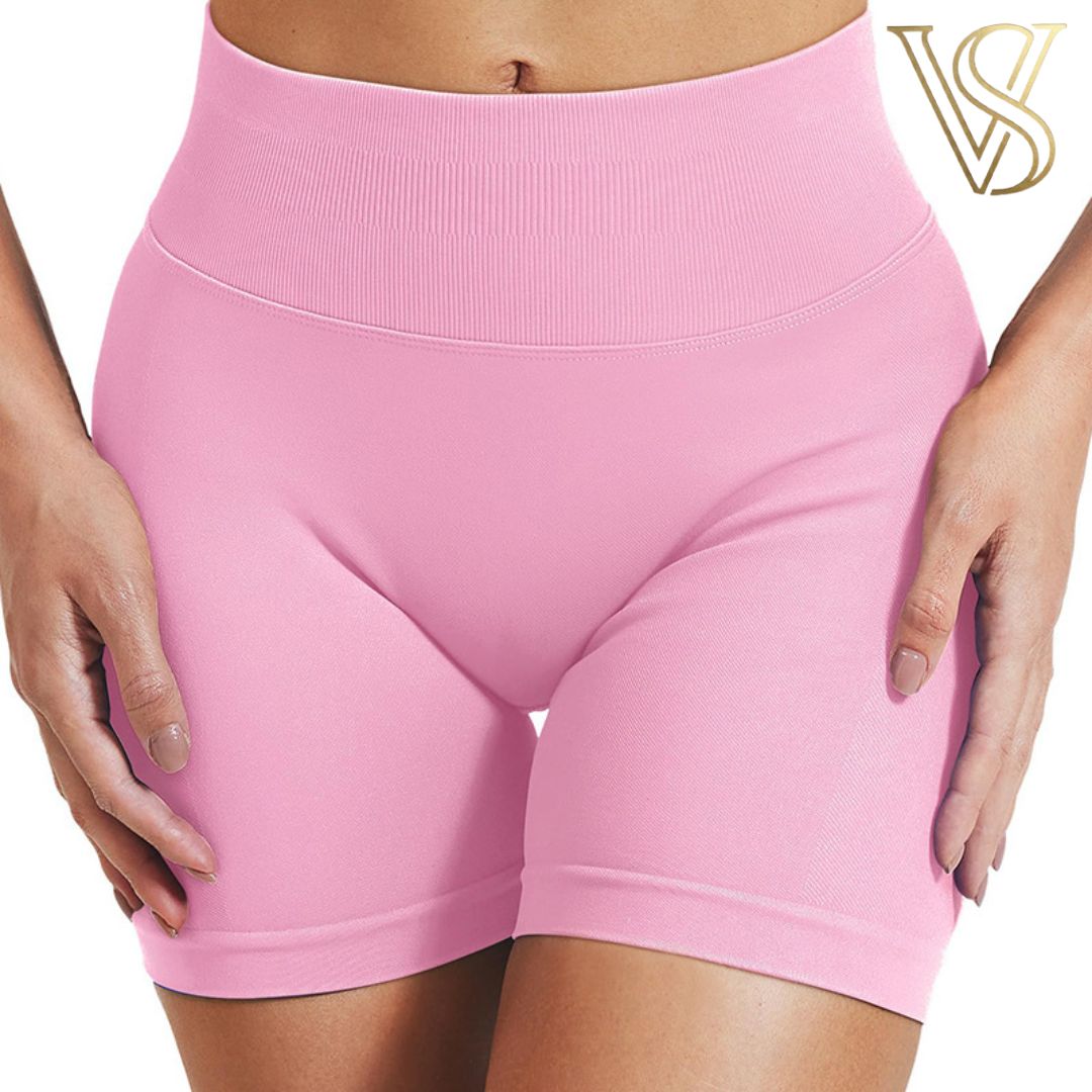 High-waisted pink seamless biker shorts for women, featuring a wide supportive waistband and a comfortable stretch fit from vstyles.