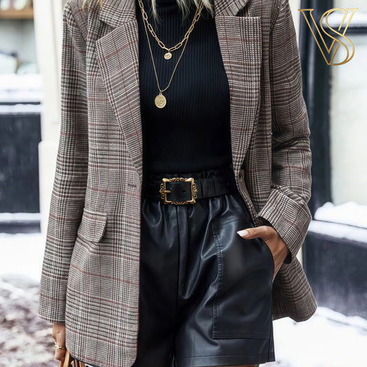 Sophisticated brown plaid blazer styled with a black turtleneck and belted faux leather shorts for a chic seasonal look at vstyles.