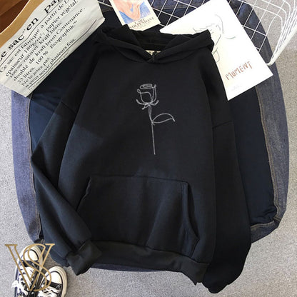 Sophisticated black oversized hoodie featuring a white single-line rose illustration, perfect for the vstyles urban aesthetic.