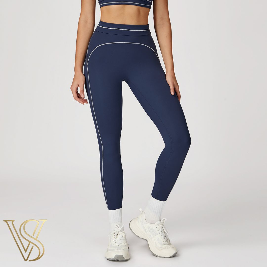 Navy blue high-waisted seamless leggings with white contrast stitching and a double-banded waist, from the vstyles activewear collection.