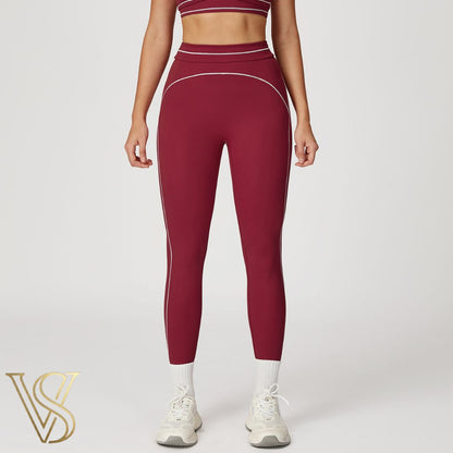 Burgundy high-waisted seamless leggings featuring white contrast stitching and a supportive double-banded waistband by vstyles.