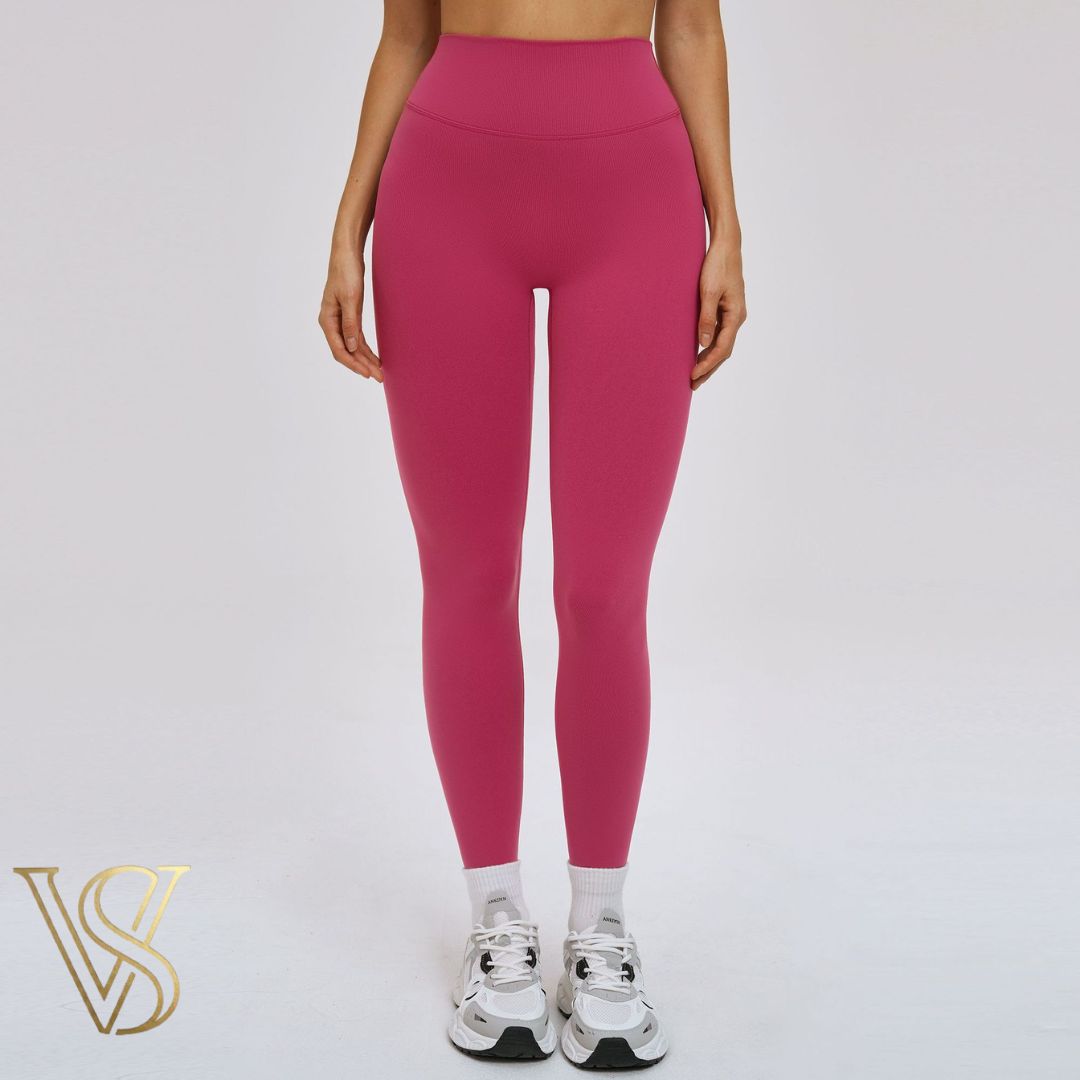 Vibrant magenta high-waisted seamless leggings, offering a contoured fit and breathable performance fabric for active lifestyles at vstyles.