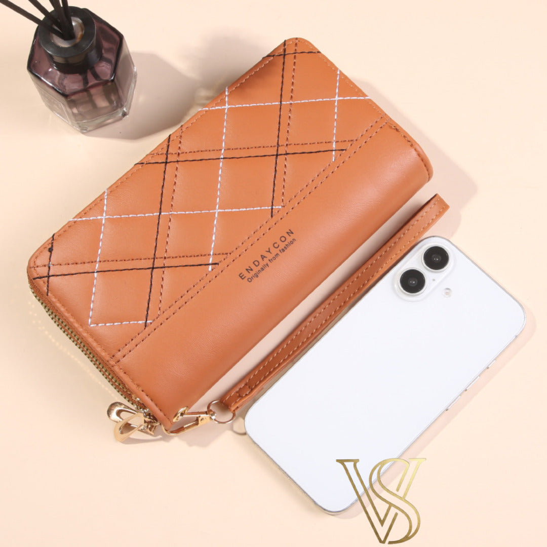 Camel brown quilted long wallet with black and white diamond stitching and double top zipper.
