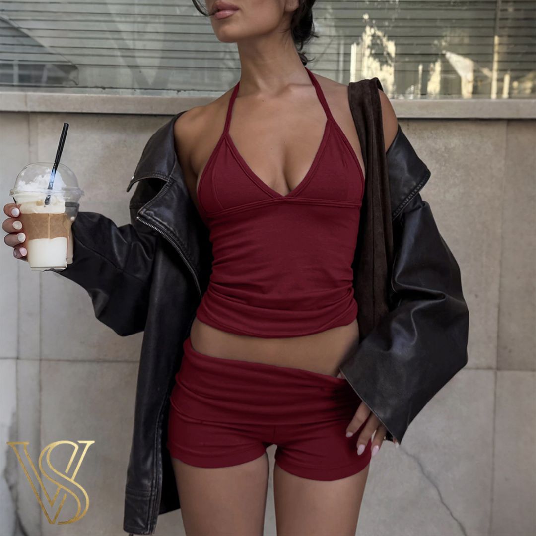 Maroon halter neck tank top and matching mini shorts set, styled with an oversized black leather jacket for a trendy vstyles urban look.