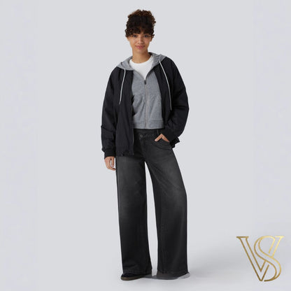 Washed black wide-leg denim with a low-waisted cut, layered with a grey zip-up and black hooded jacket for a cozy urban look by vstyles.