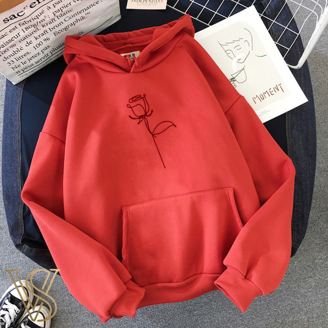 Bold red oversized hoodie with a minimalist black single-line rose illustration on the center chest, designed for your e-commerce store.