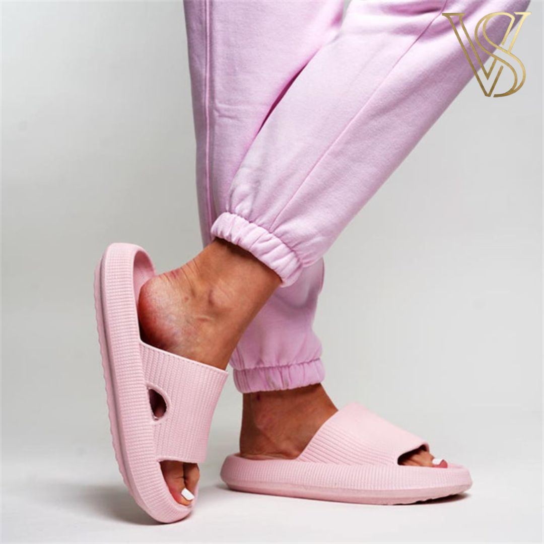 Soft pastel pink cloud slides with an ergonomic cushioned sole and lightweight seamless construction from vstyles.